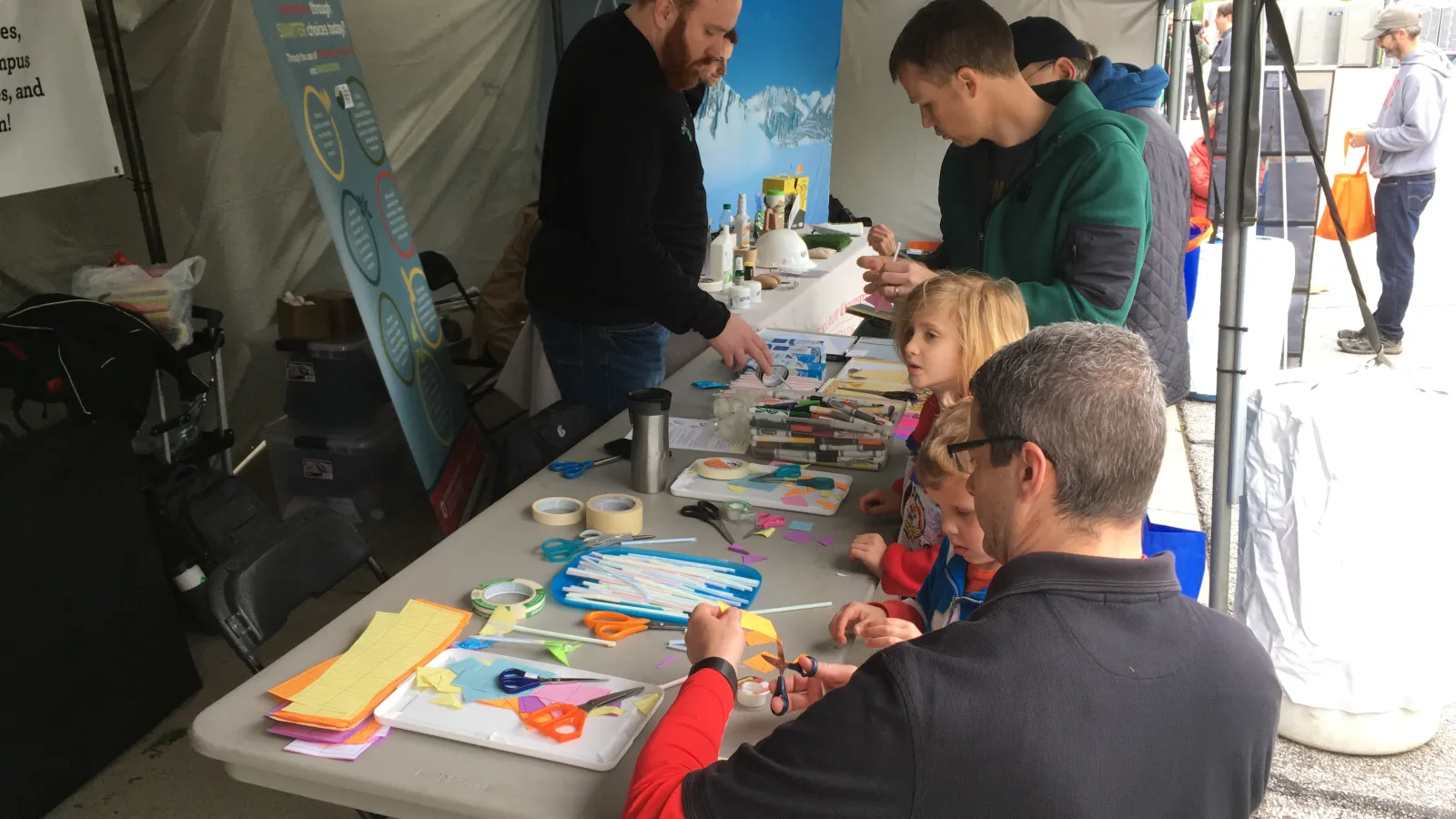 People doing arts and crafts around a table
