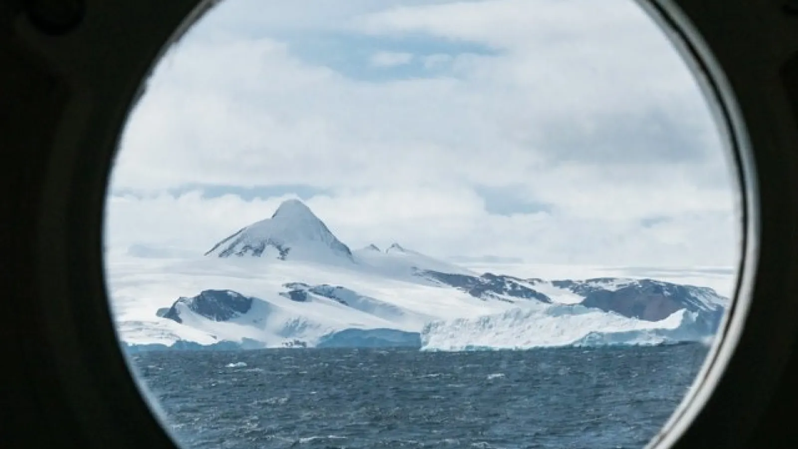Snow covered mountains and water