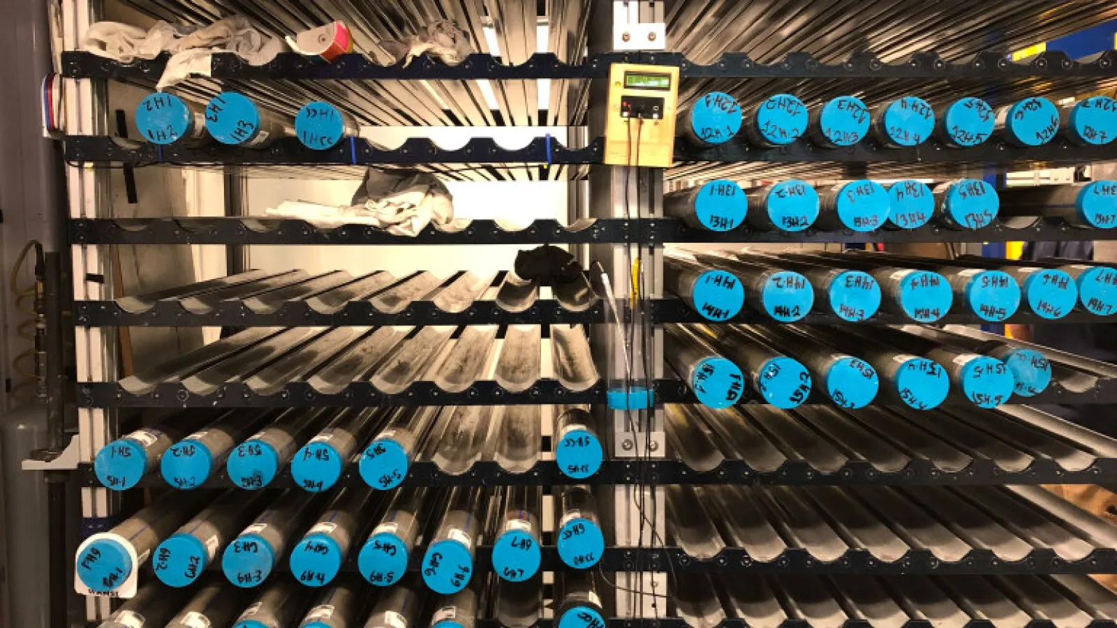 Core racks filled with whole-round core sections waiting to be analyzed and split. 