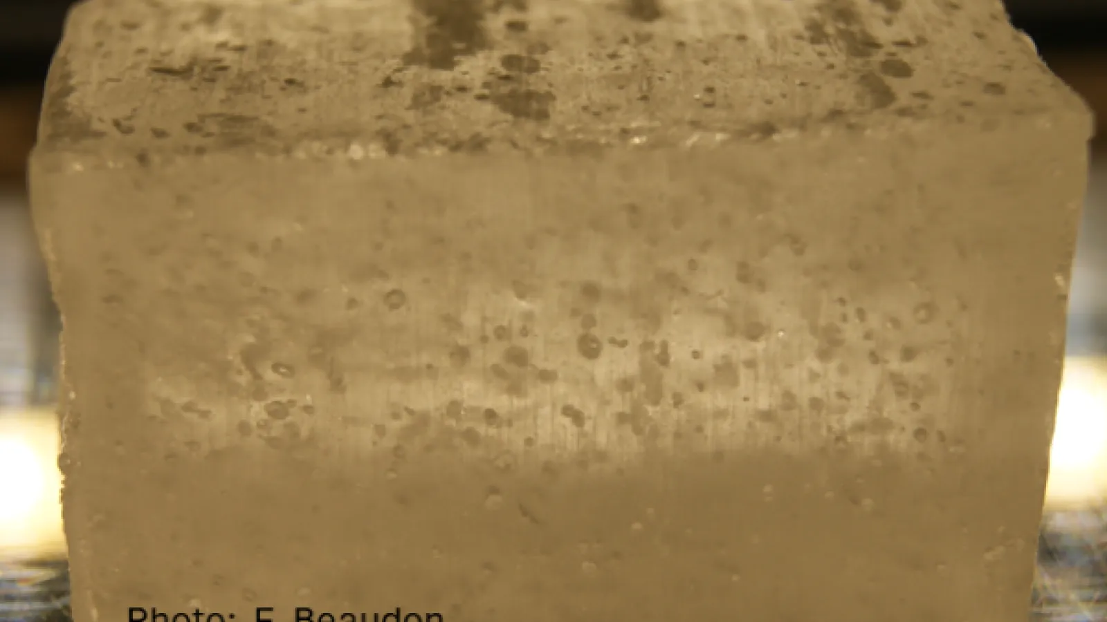 A block of ancient, dirty ice with particles of dust in it.