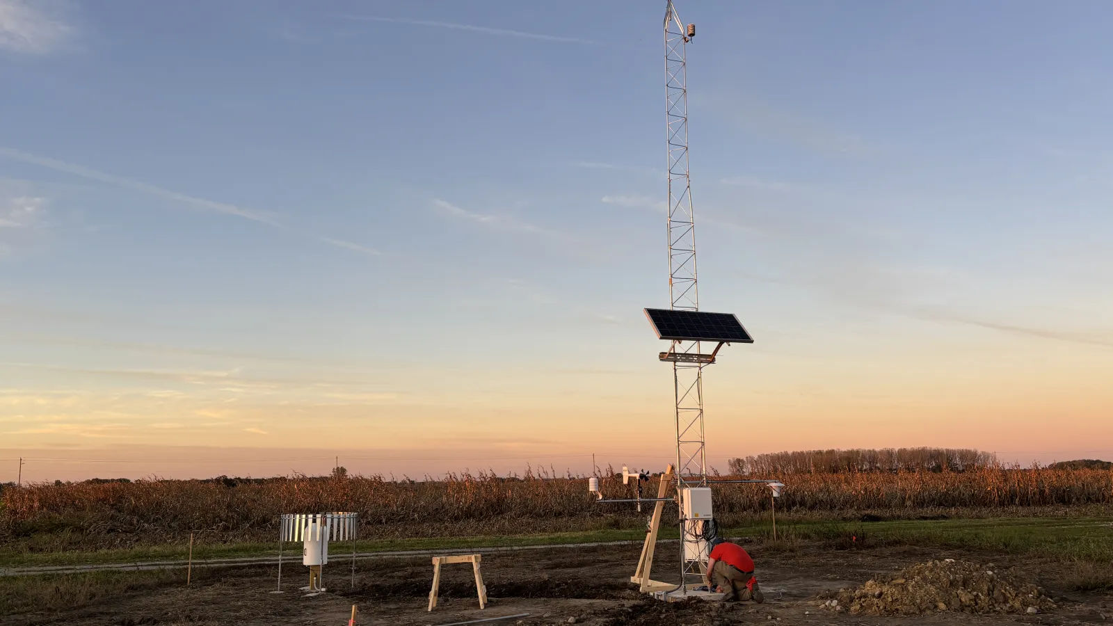 Ohio Mesonet Station on a farm with a sunset in the background