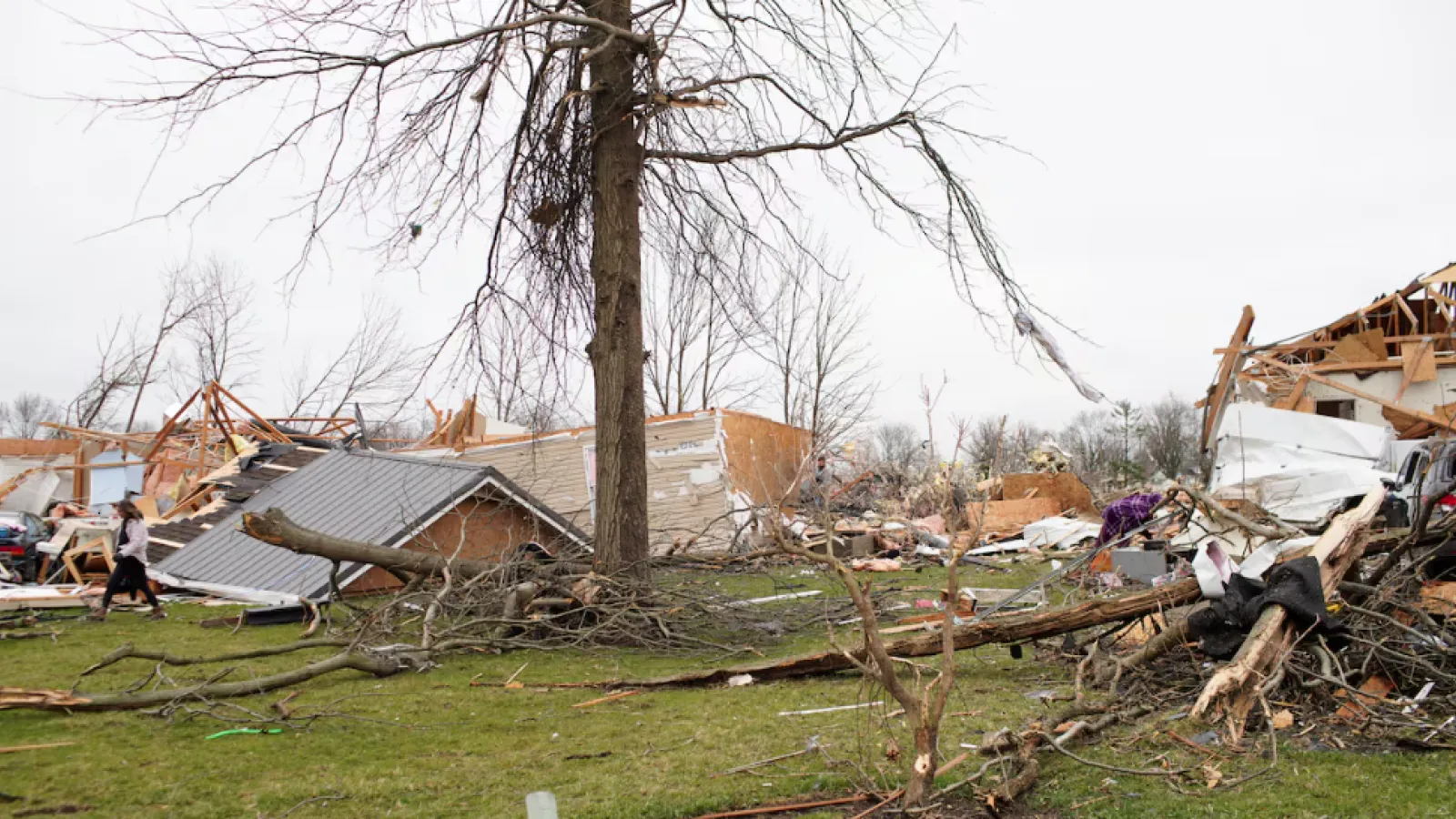 Damaged homes, trees, and yards in Indian Lake after a tornado swept through in 2024.